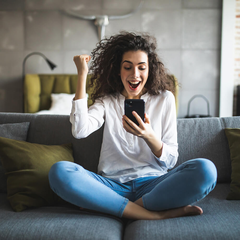 Person smiling at phone