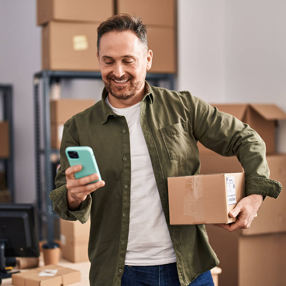 Person smiling at phone